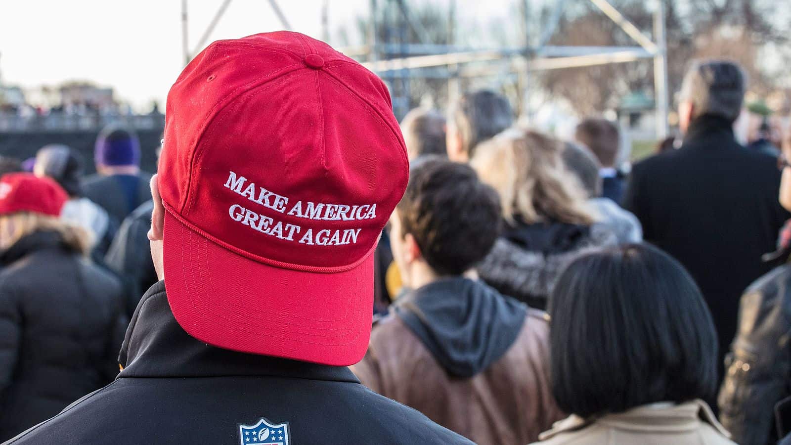 Guy wearing a red MAGA hat